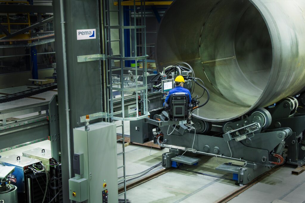 PEMA assembly and welding station operator in a chair