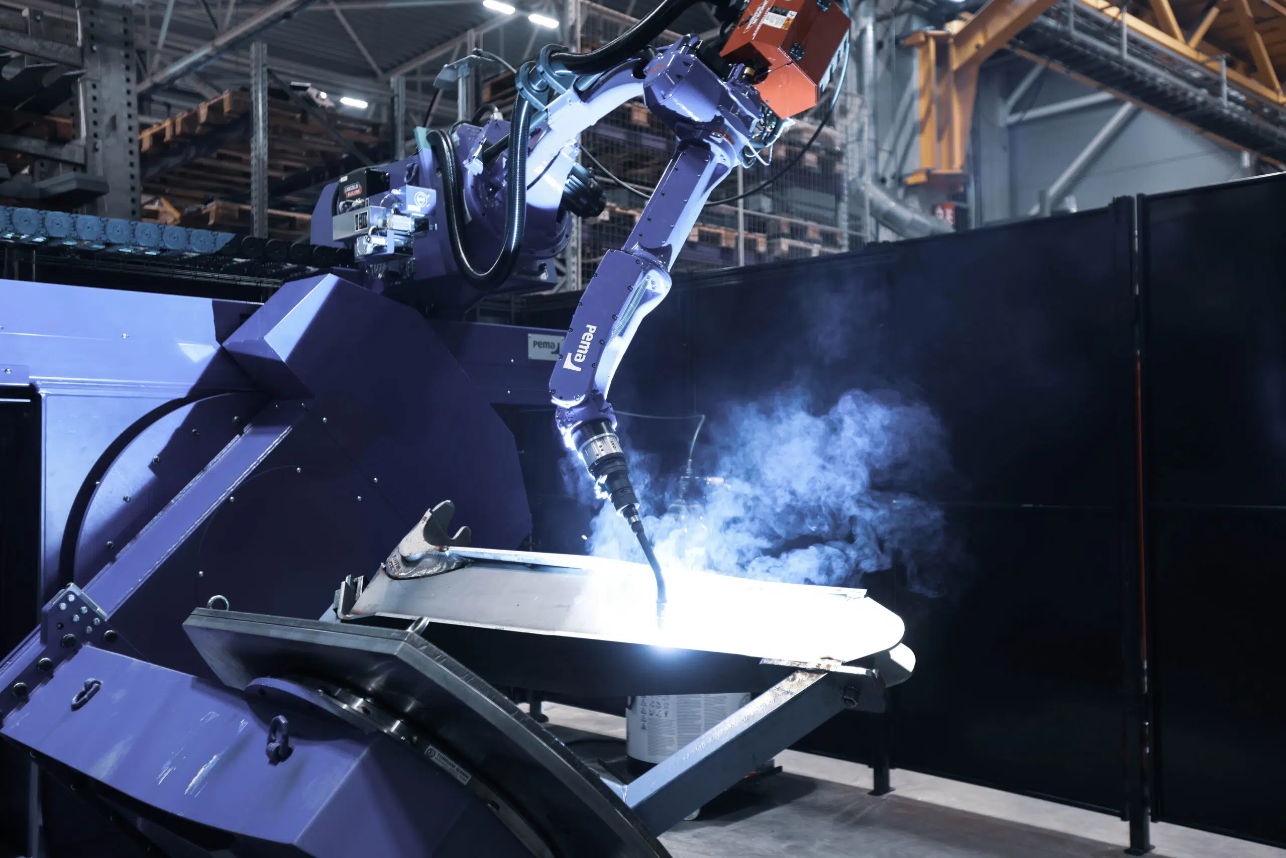 Close up picture of PEMA robotic welding solution for heavy equipment.